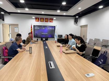 A group of people sitting at a tableDescription automatically generated